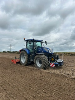 Blue tractor in a field