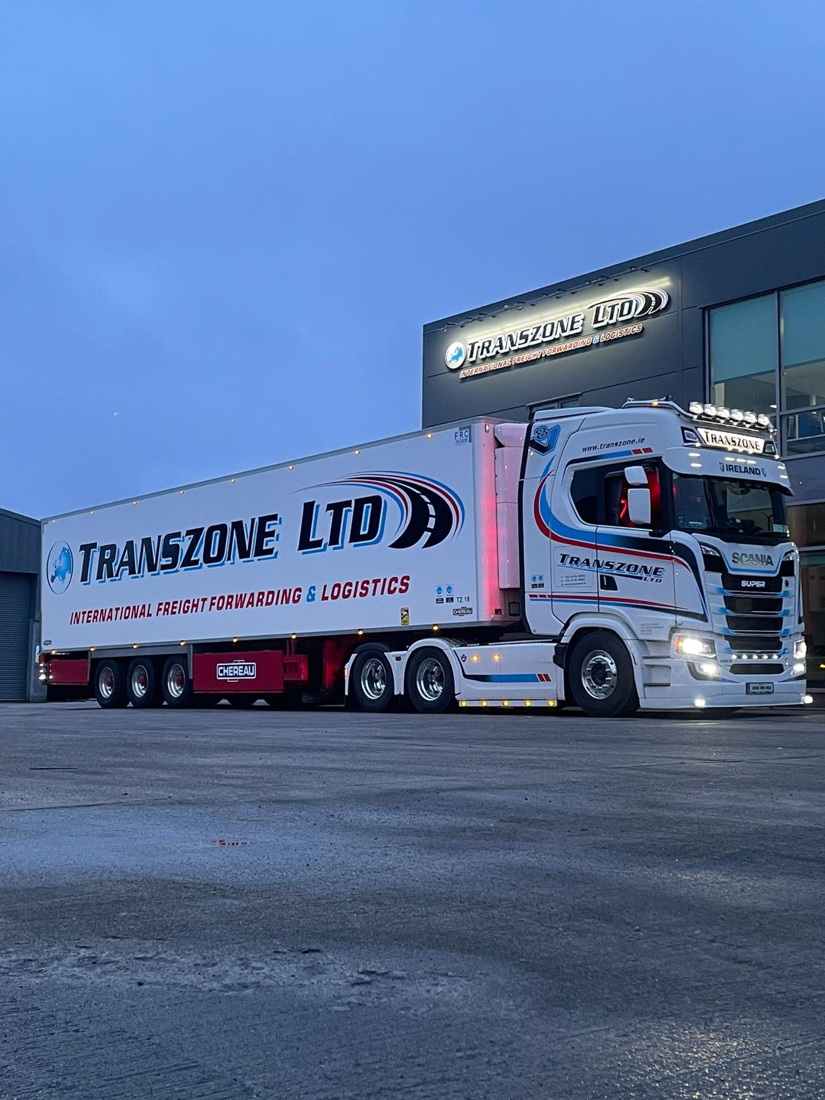 Tranzone truck lit up at dusk